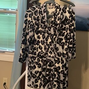 Chico’s, black and white, leopard print blouse with V neck and pockets.